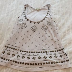Unique white tank with brass beading